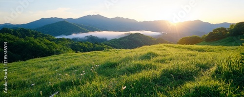 Serene Mountain Landscape at Sunrise with Lush Green Fields and Misty Valleys Under a Vibrant Sky