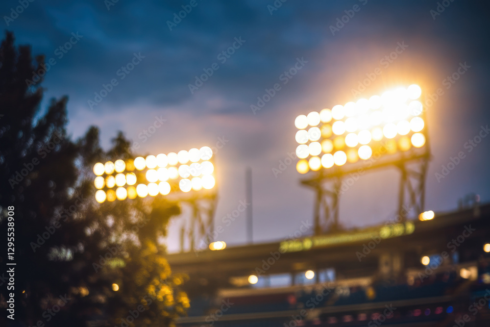 Obraz premium Stadium lights glowing against night sky