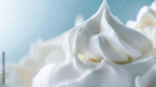 Close up view of fluffy whipped cream texture against a soft blue background for culinary uses : Generative AI photo
