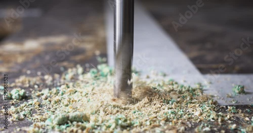 Wallpaper Mural Drill bit piercing through material creating green dust Torontodigital.ca