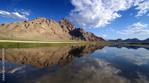 Majestic Mountain Reflection in Clear Water Under Blue Sky with Clouds : Generative AI photo
