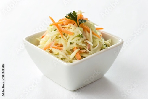 coleslaw in a small white dish on white photo