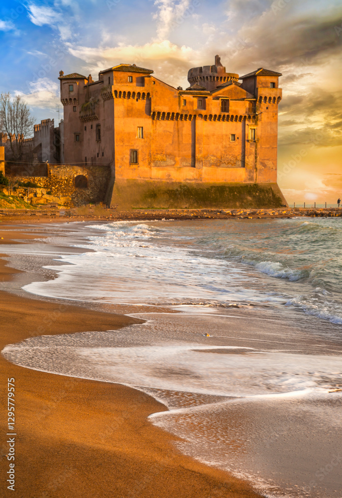 Great Medieval castles of Italy - beautifil Castello Santa Severa on the beach over sunset. Lazio region. drammatic sea beach landscape