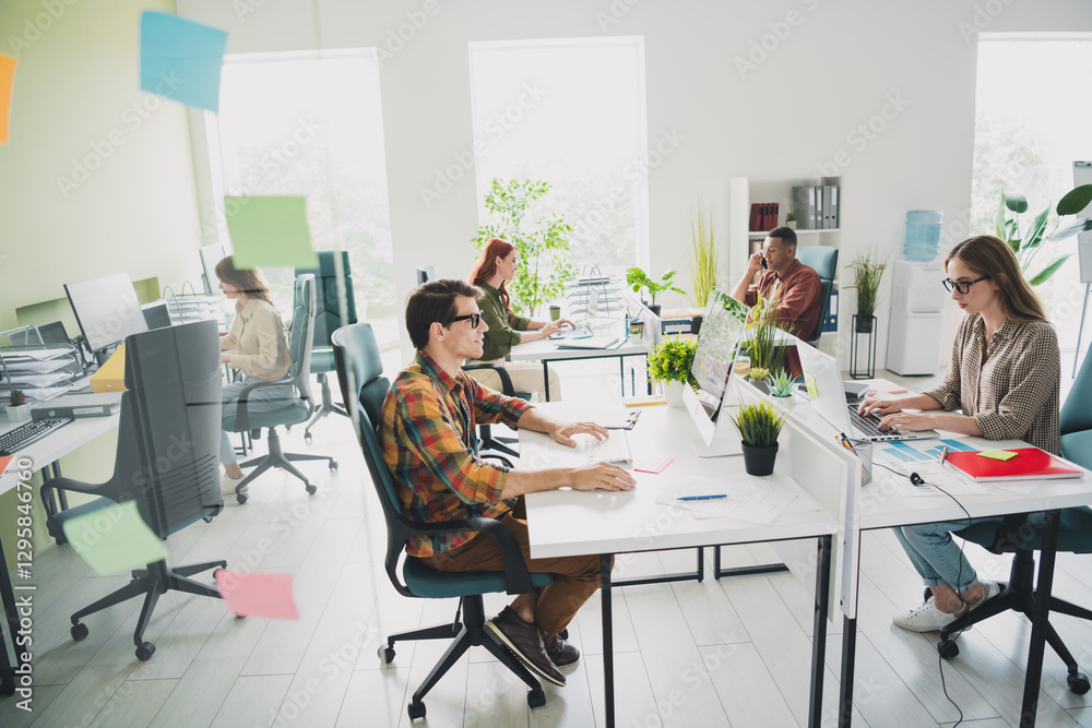Photo of young age sales managers colleagues business people workspace location indoors modern design office diversity cooperation Photo of young age sales managers colleagues business people workspace location indoors modern design office diversity cooperation