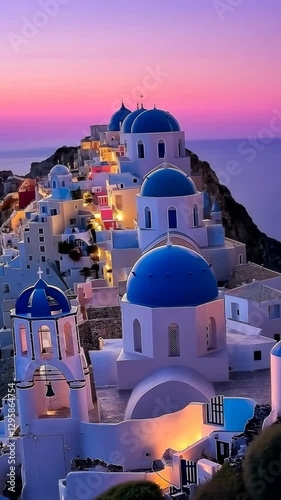 Stunning sunset view of Santorini with blue domed buildings along the cliffside