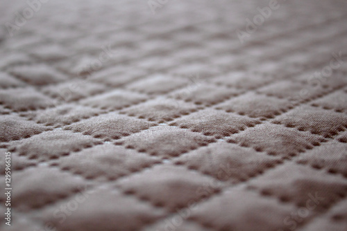 Light quilt bedcover with relief Narrow focus line, shallow depth of field