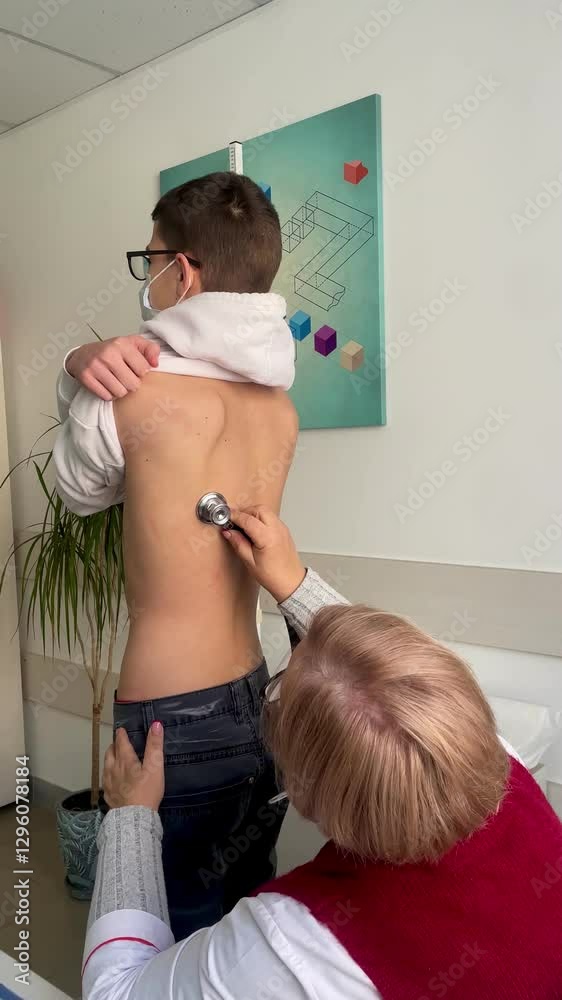 Doctor Using Stethoscope to Examine Patient's Lungs in Medical Checkup, pneumonia, bronchitis, flu, virus, coronavirus, epidemic