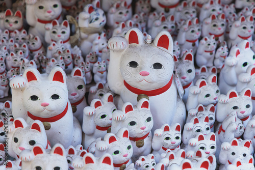 Gotokuji Temple in fall sunny day, Daikeizan Gotoku-ji in Setagaya ward, Tokyo, Japan, buddhist temple, Maneki-neko temple, with beckoning cat figurine toys, temple with japanese fortune lucky cats photo