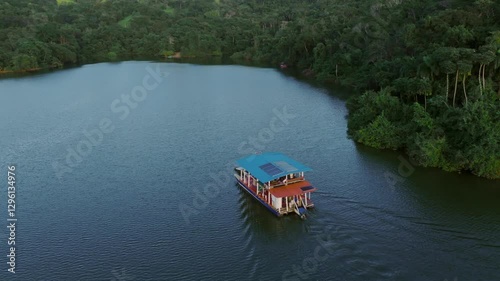 Ferry tour on the the Hatillo Dam Lake, Dominican Republic. Journey near the tropical lake shores photo