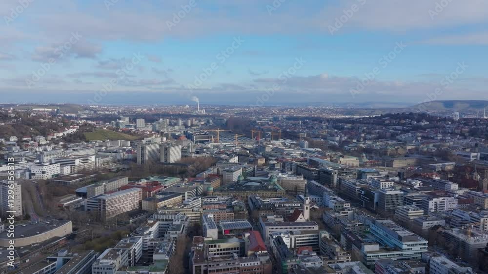 Urban Stuttgart skyline expanding under a clear blue sky, showcasing architectural landscape and city infrastructure from aerial perspective Urban Stuttgart skyline expanding under a clear blue sky, showcasing architectural landscape and city infrastructure from aerial perspective