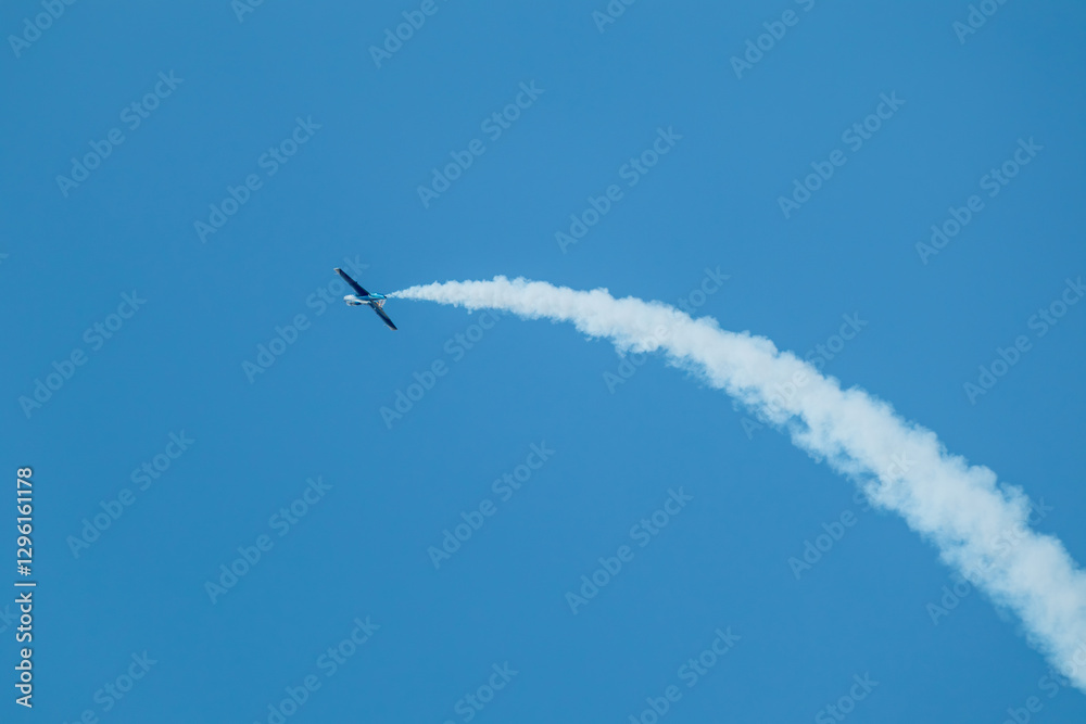 L-29 Jet Plane with Contrails on Blue Sky L-29 Jet Plane with Contrails on Blue Sky