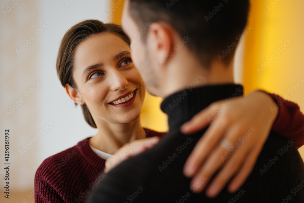 Fototapeta premium Couple sharing a joyful moment in intimate setting indoors