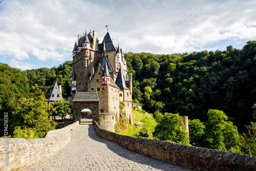 Eltz Castle, a medieval castle located in Germany, Rheinland Pfalz, Mosel region. Beautiful old castle, famous tourist attraction on sunny summer day, empty, without people, nobody. photo