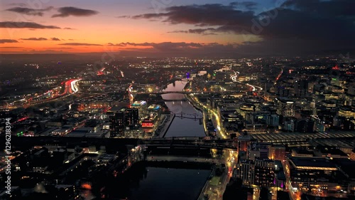 Sunset night aerial city Glasgow Scotland and river Clyde rush hour traffic 