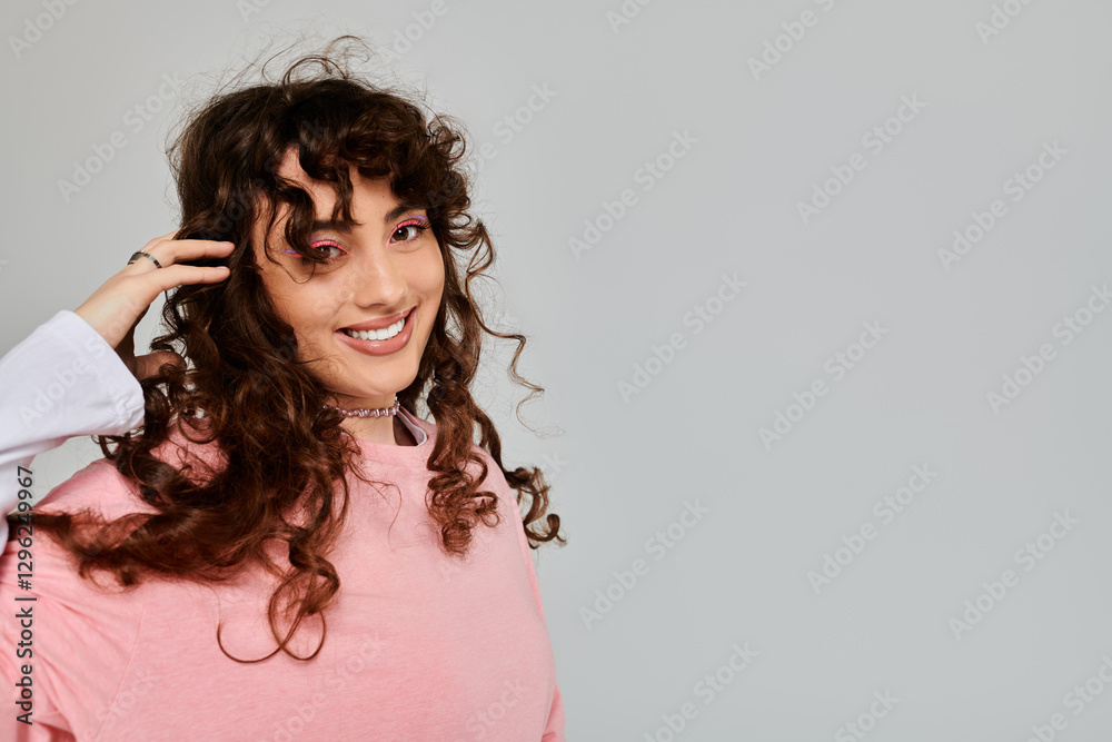 Emotional expression of a young stylish woman with curly hair in a light toned setting Emotional expression of a young stylish woman with curly hair in a light toned setting