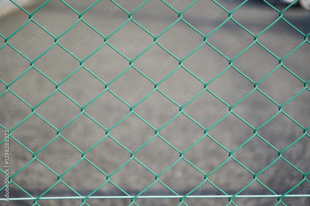 Naklejka premium 緑色の金属製のフェンス・金属素材の背景（背景テクスチャーシリーズ）