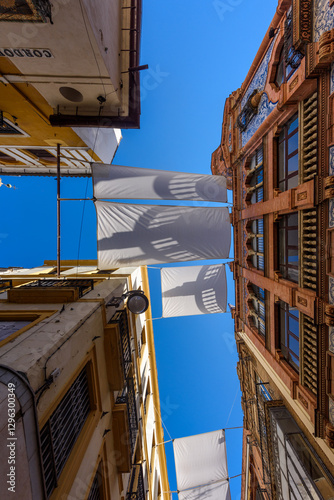 Obraz na płótnie Seville, Spain - August 01, 2024: Walking the streets of the old town of Seville, Spain. w salonie