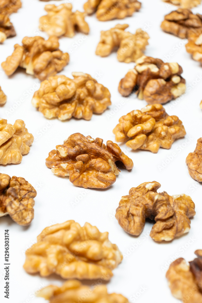 Shelled walnuts on a white background close-up Shelled walnuts on a white background close-up