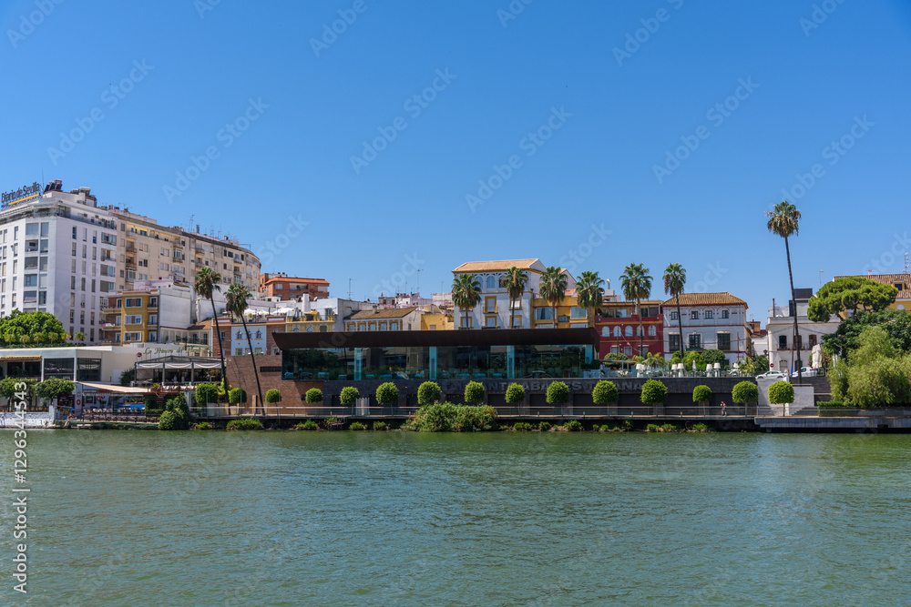 Seville, Spain - August 01, 2024: Guadalquivir river cityscape, Seville, Spain