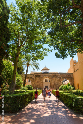 Obraz na płótnie Sevilla, Spain - August 01, 2024: Patio de las Doncellas in Royal palace, Real Alcazar (built in 1360) in Seville, Andalusia, Spain. The Alcázar of Seville, officially called Royal Alcázar of Seville, w salonie