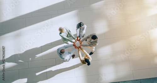 Top view of business people, fist bump and support in team, success and solidarity with mission and synergy, Hands together, corporate group in circle with support and collaboration in meeting