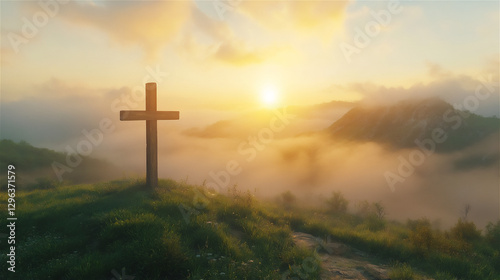 A wooden cross standing on a green hill at sunrise, with golden light shining through the clouds.