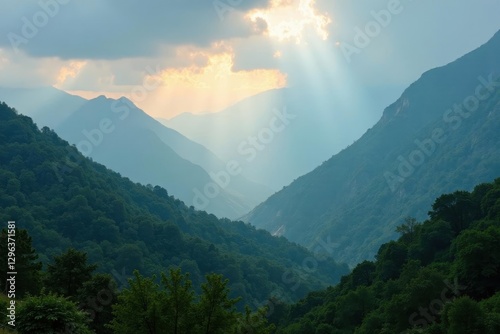 Misty mountains with a faint rainbow after rain shower , aerial, soft, vegetation