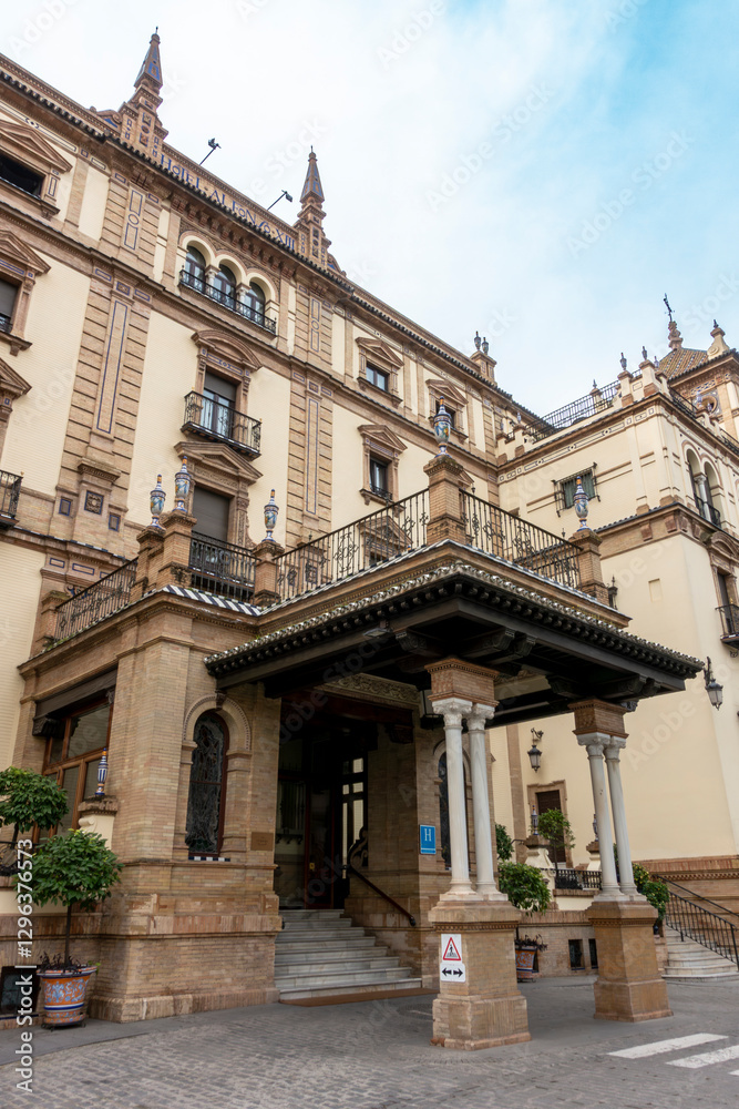 Fototapeta premium Seville, Andalusia, Spain; February 15, 2025: Entrance to the Alfonso XIII Hotel, built between 1916 and 1928 for the Ibero-American Exposition of 1929.