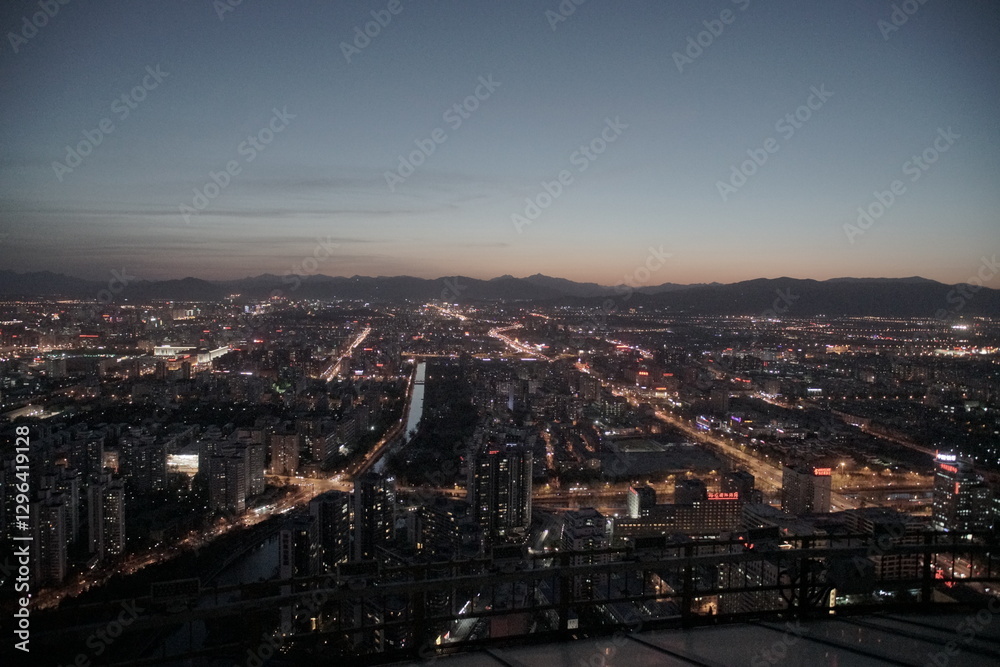Evening Beijing city skyline with mountains in background Evening Beijing city skyline with mountains in background