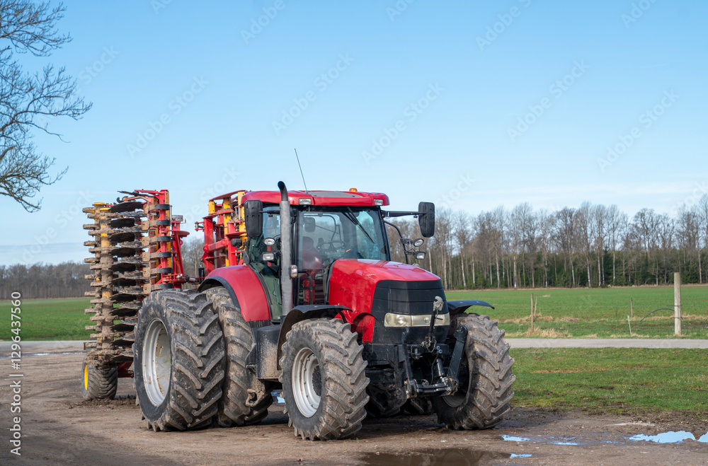 Red tractor in the field Red tractor in the field