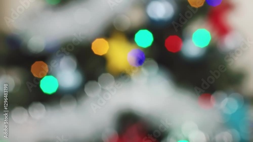 Wallpaper Mural view of glowing Christmas tree lights in vibrant colors, focusing on their twinkling effect, evoking holiday Torontodigital.ca