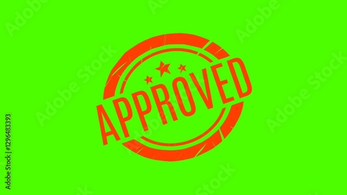 Close-up video showing a bright red 'APPROVED' stamp on a solid green surface. Suitable for projects that require visualization of approval, validation, or completion.