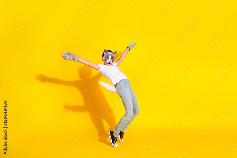 Young girl in playful costume posing with a bright yellow background showcasing vibrant cosplay energy Young girl in playful costume posing with a bright yellow background showcasing vibrant cosplay energy