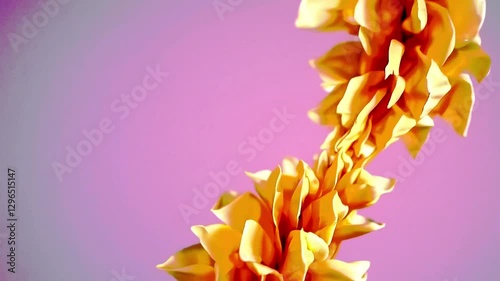 Golden Yellow Flower Garland Against Soft Pink Background in Artistic Macro Photography.