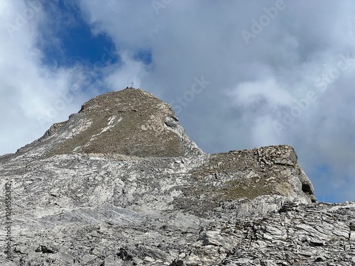 Alpine peak Barglen Schiben (2669 m) above the Tannensee lake (or Tannen lake) and in the Uri Alps mountain massif, Melchtal - Canton of Obwalden, Switzerland (Kanton Obwald, Schweiz) photo