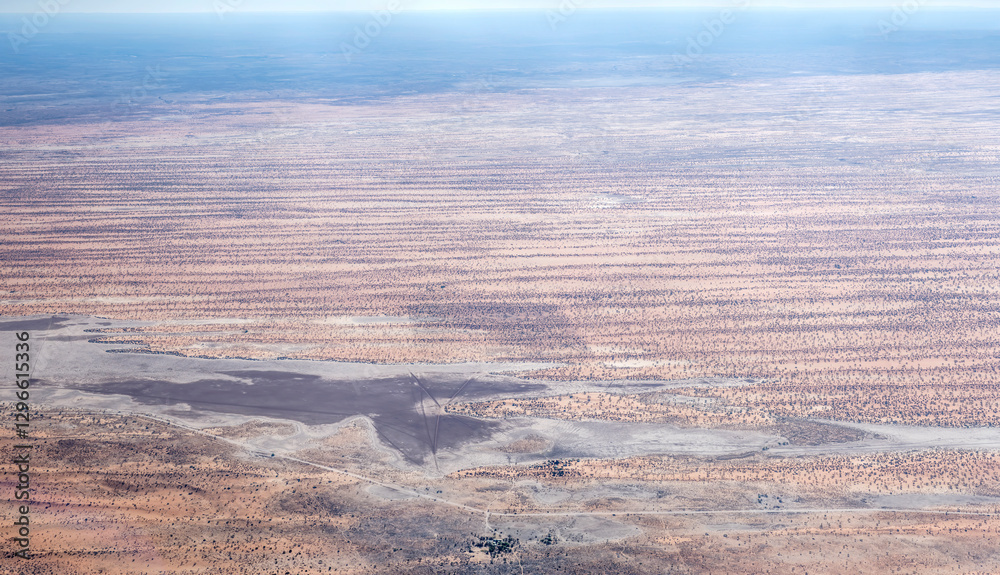 stripes of red dunes and pan in Kalahari desert countryside, near Intu Afrika lodge, Namibia