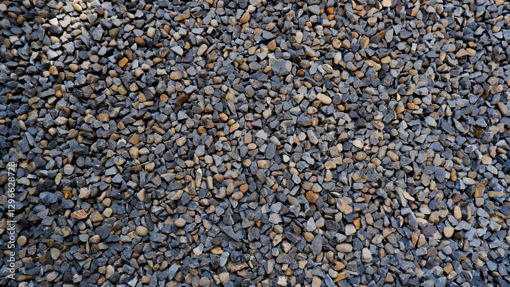 Pebble texture or pebble background for home accent. Original grunge texture background and small stones. Top view of gravel driveway on the ground Pebble texture or pebble background for home accent. Original grunge texture background and small stones. Top view of gravel driveway on the ground