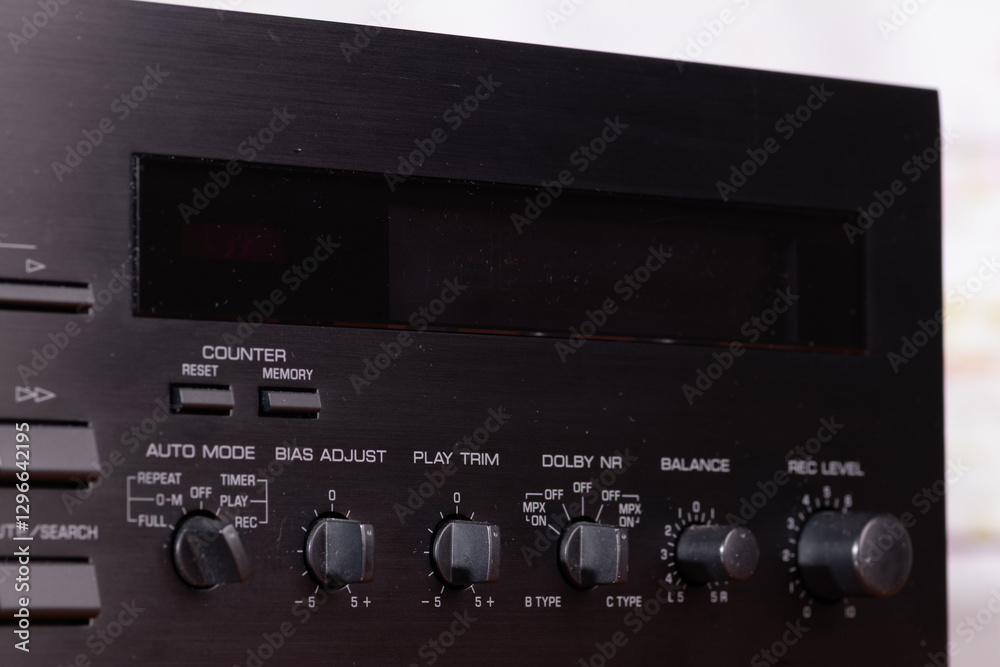 Fototapeta premium Vintage Audio Tape Deck with Illuminated Display and Control Knobs