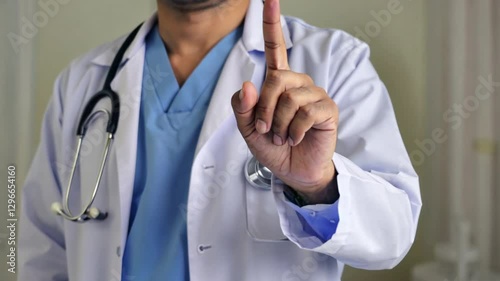Doctor Gesturing Calmly with One Finger in Medical Setting