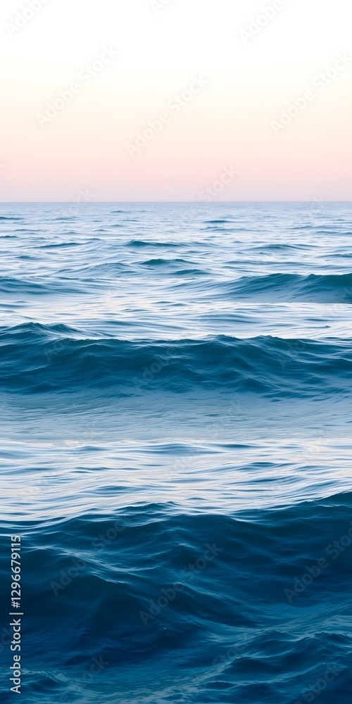 Obraz premium A serene ocean view with gentle waves and a soft blue gradient, perfect for a calming mobile wallpaper backdrop. 