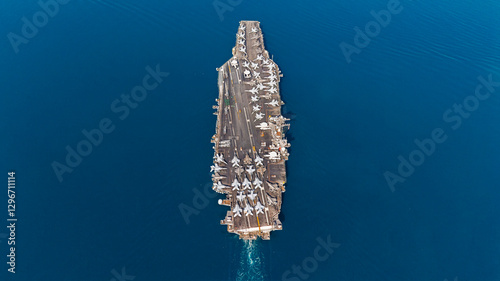 Aerial view military navy ship carrier at blue sea.