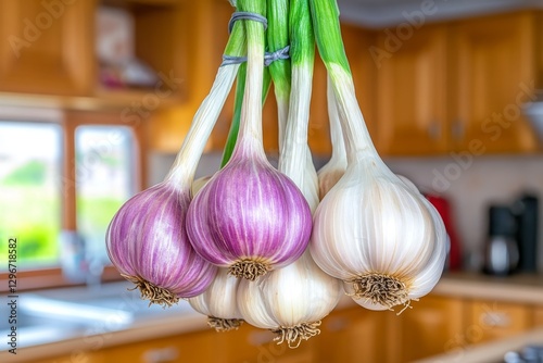 A bunch of garlic bulbs hanging to dry in a farmhouse kitchen