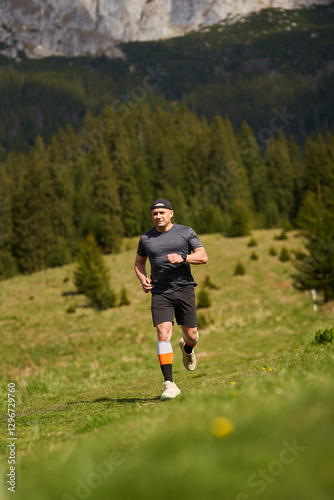 Trail runner in mountain landscape........
