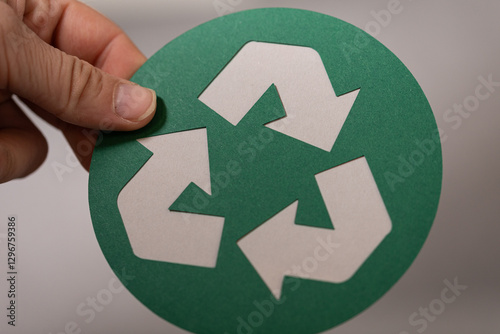 Hand holding a paper cut-ou...