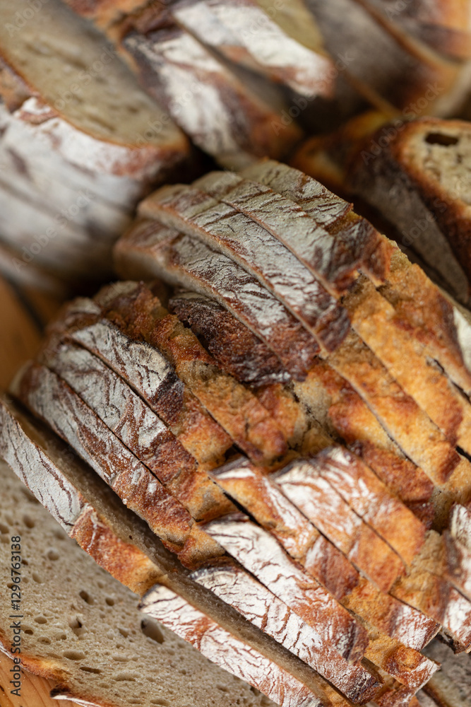 Close-up of rustic, sliced bread. Perfect for bakery, food blogs, and culinary websites. Close-up of rustic, sliced bread. Perfect for bakery, food blogs, and culinary websites.