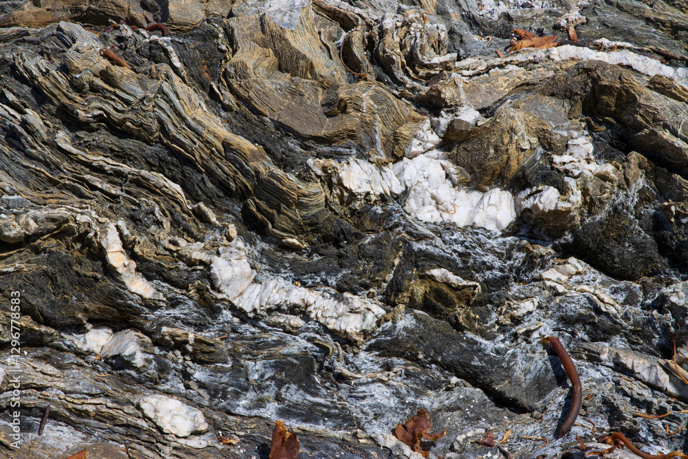 Rock formation with quartz veins on La Ballena beach, Pichilemu, Chile Rock formation with quartz veins on La Ballena beach, Pichilemu, Chile