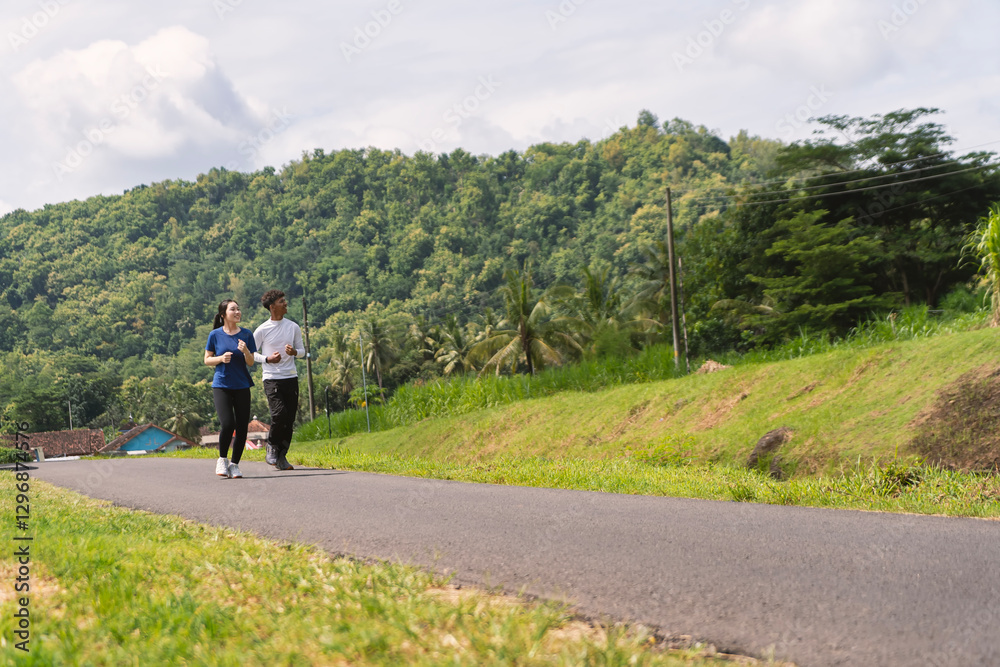 active asian young couple jogging and running exercise at rural area active asian young couple jogging and running exercise at rural area