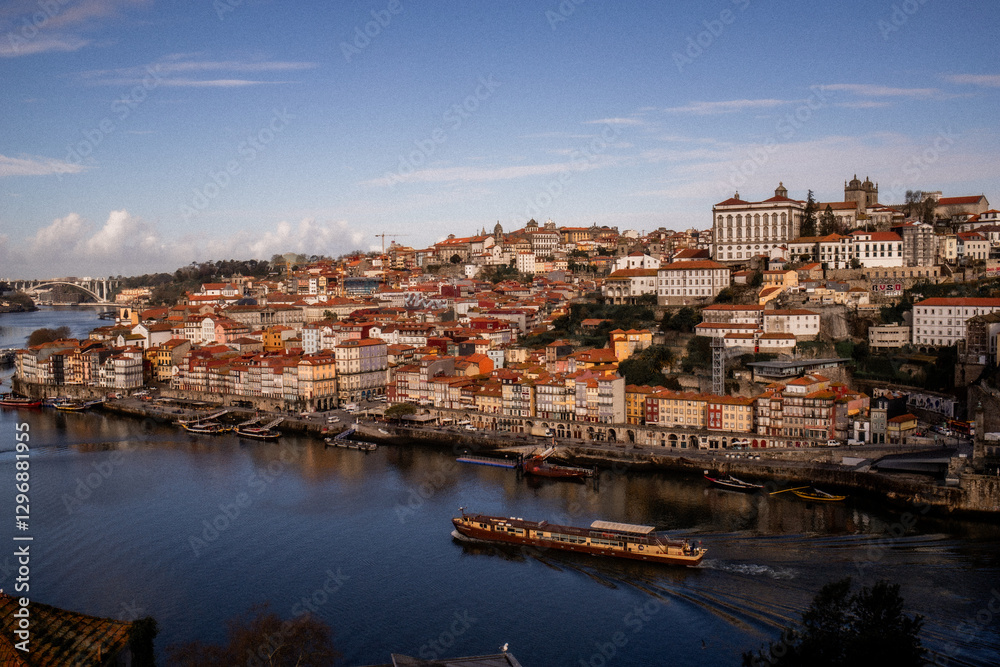 Fototapeta premium A stunning view of the Douro River in Porto, Portugal, showcasing the city’s historic architecture