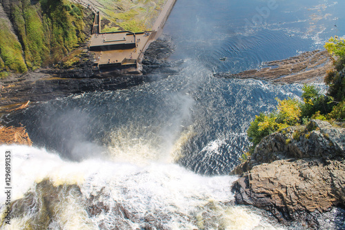 Aerial view of Montmorency Falls from above showing powerful water crashing into basin below