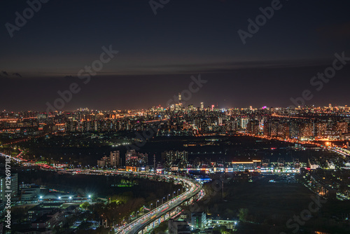 Wallpaper Mural An aerial view of the brightly lit and bustling scene of Beijing's urban night view in China Torontodigital.ca
